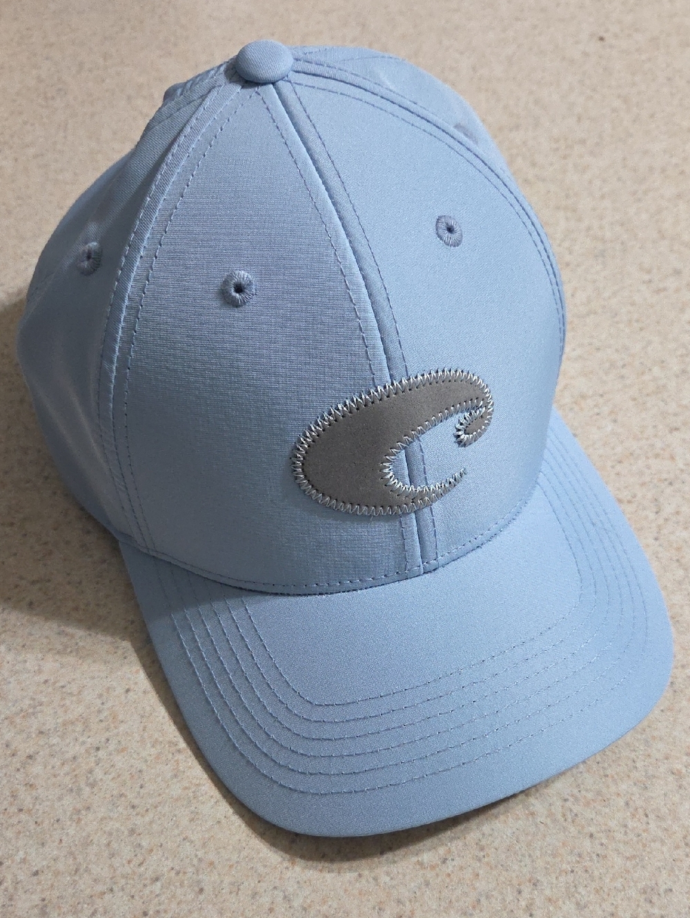 Unisex Costa Quick Dry Light Blue Cap with Silver Emblem Velcro Back